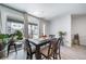 Bright and airy dining room with a modern table set, perfect for Gathering meals and entertaining at 7484 W Atlantic Ln, Denver, CO 80227