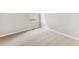 A bright bedroom with neutral carpet, a window and base trim throughout at 869 Sawdust Dr, Brighton, CO 80601