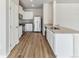 Modern kitchen featuring white cabinets, stainless steel appliances, and granite countertops at 869 Sawdust Dr, Brighton, CO 80601