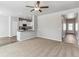 Bright and airy living room adjacent to the kitchen with neutral colors at 869 Sawdust Dr, Brighton, CO 80601