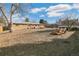 Expansive backyard featuring mature trees, outdoor furniture, and plenty of room to enjoy the outdoors at 6581 S Logan St, Centennial, CO 80121