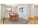 Cozy dining room with hardwood floors, natural light, and a stylish chandelier at 6581 S Logan St, Centennial, CO 80121