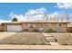 Single story home with brick facade, a well-maintained lawn, and an attached one car garage at 6581 S Logan St, Centennial, CO 80121