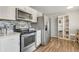 Bright kitchen with stainless steel appliances and modern tile backsplash at 6581 S Logan St, Centennial, CO 80121