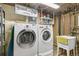 Laundry room with washer, dryer, utility sink, and laundry accessories, conveniently organized at 6581 S Logan St, Centennial, CO 80121