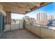 Balcony overlooking cityscape, with concrete floors, steel railing, and overhead lighting at 700 N Washington St # 502, Denver, CO 80203