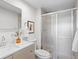 Modern bathroom features new vanity, glass enclosed shower, and contemporary finishes at 700 N Washington St # 502, Denver, CO 80203