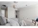 Bright bedroom with carpet, modern orb chandelier, and access to en suite bathroom at 700 N Washington St # 502, Denver, CO 80203