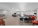 Large common room featuring lounge area with TV and multiple tables with chairs, perfect for entertaining guests at 700 N Washington St # 502, Denver, CO 80203