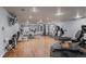 Gym featuring wood floors, mirrors, exercise equipment, and television at 700 N Washington St # 502, Denver, CO 80203