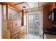 Kitchen area with wood cabinetry, view to balcony and retro styled ceiling at 700 N Washington St # 502, Denver, CO 80203