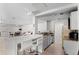 Well-equipped kitchenette featuring countertop seating, modern appliances and plenty of room for entertaining at 700 N Washington St # 502, Denver, CO 80203