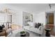 Open-concept living space with a dining area and neutral-toned furnishings at 700 N Washington St # 502, Denver, CO 80203