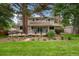 Expansive backyard features a well-manicured lawn and a charming patio area at 8666 E Easter Ave, Centennial, CO 80112