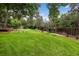Spacious backyard with a playset, bordered by a fence, perfect for activities at 8666 E Easter Ave, Centennial, CO 80112