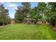 Lush backyard is perfect for outdoor activities, complete with mature trees at 8666 E Easter Ave, Centennial, CO 80112