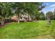 Lush backyard with mature trees and a playset, ideal for Gathering fun and relaxation at 8666 E Easter Ave, Centennial, CO 80112
