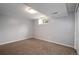 Finished basement bedroom with neutral walls and carpet and a small window for light at 8666 E Easter Ave, Centennial, CO 80112