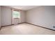 Spacious bedroom with neutral walls, plush carpeting and a window with natural light at 8666 E Easter Ave, Centennial, CO 80112