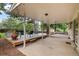 Spacious covered patio with outdoor seating, ideal for relaxation and enjoying the backyard at 8666 E Easter Ave, Centennial, CO 80112