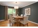 Dining room featuring neutral decor, modern lighting, and a large window at 8666 E Easter Ave, Centennial, CO 80112