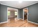 Open-concept floor plan with hardwood floors seamlessly connects living spaces and kitchen at 8666 E Easter Ave, Centennial, CO 80112