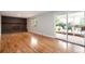 Spacious living room showcases hardwood floors and a stunning brick fireplace, perfect for gatherings at 8666 E Easter Ave, Centennial, CO 80112