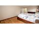 Bright main bedroom featuring hardwood floors and a comfortable bed at 8666 E Easter Ave, Centennial, CO 80112