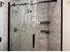 Modern shower with a sleek design, featuring a frameless glass door and a rainfall showerhead at 8666 E Easter Ave, Centennial, CO 80112