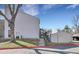 A bright exterior shot of a two-story house with well-kept landscaping under a sunny blue sky at 3550 S Harlan St # 174, Denver, CO 80235