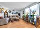 Inviting living room with a comfortable sofa, decorative accents, and natural light streaming through the windows at 3550 S Harlan St # 174, Denver, CO 80235