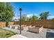 Landscaped backyard featuring raised garden beds and a charming outdoor space at 7160 Canosa Ct, Westminster, CO 80030