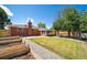 Spacious backyard with a brick home, patio area, garden, and plenty of green space at 7160 Canosa Ct, Westminster, CO 80030