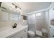 Updated bathroom with modern vanity, shower with a built-in bench, and bright lighting at 7160 Canosa Ct, Westminster, CO 80030
