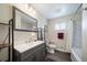 Modern bathroom featuring a sink, dark wood floors, a bathtub, a shower, and neutral décor at 7160 Canosa Ct, Westminster, CO 80030