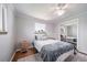 Comfortable bedroom with a bed, hardwood floors, two windows, neutral décor, and ample light at 7160 Canosa Ct, Westminster, CO 80030
