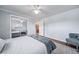 Calming bedroom featuring hardwood floors, ample light, a mirrored closet, and neutral décor at 7160 Canosa Ct, Westminster, CO 80030