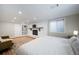 Bedroom with fireplace, TV, hardwood floors, and white bedding at 7160 Canosa Ct, Westminster, CO 80030