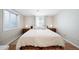 Bright bedroom with hardwood floors, large windows, and two nightstands at 7160 Canosa Ct, Westminster, CO 80030