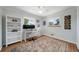 Cozy bedroom with natural light, a ceiling fan, a work station, and hardwood floors at 7160 Canosa Ct, Westminster, CO 80030
