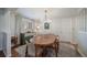 Dining room featuring hardwood floors, an oval table, a buffet, and a statement light fixture at 7160 Canosa Ct, Westminster, CO 80030