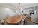 Elegant dining room showcasing a large wood table and an open-concept design to the living room at 7160 Canosa Ct, Westminster, CO 80030
