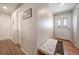 Bright entryway featuring hardwood floors, a stylish front door, and a cozy bench at 7160 Canosa Ct, Westminster, CO 80030