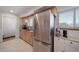 Kitchen featuring stainless appliances and sink with wooden cabinetry and granite countertops at 7160 Canosa Ct, Westminster, CO 80030