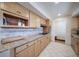 Kitchen with granite countertops, tile backsplash, stainless appliances, and wooden cabinetry at 7160 Canosa Ct, Westminster, CO 80030