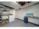 Functional laundry room with a utility sink, washer, dryer, and storage space at 7160 Canosa Ct, Westminster, CO 80030