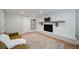 Cozy living room with brick fireplace, mounted TV, built-in shelving, and neutral decor at 7160 Canosa Ct, Westminster, CO 80030
