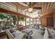 Beautiful sunroom with ample natural light, brick accents, and a view of the backyard at 7160 Canosa Ct, Westminster, CO 80030