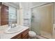 Standard bathroom with a vanity, mirrored cabinet, and glass-enclosed shower at 3625 E 128Th Pl, Thornton, CO 80241