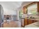Bright kitchen with stainless steel appliances and sliding glass doors to the backyard at 3625 E 128Th Pl, Thornton, CO 80241